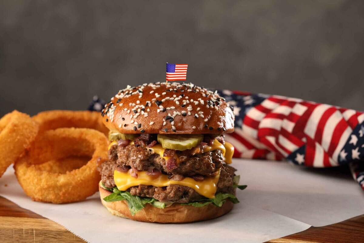 The Freedom Burger at Hickory Tavern comes with two beef patties, American cheese, roasted onions, pickles, a house-made sauce and a sesame seed bun.